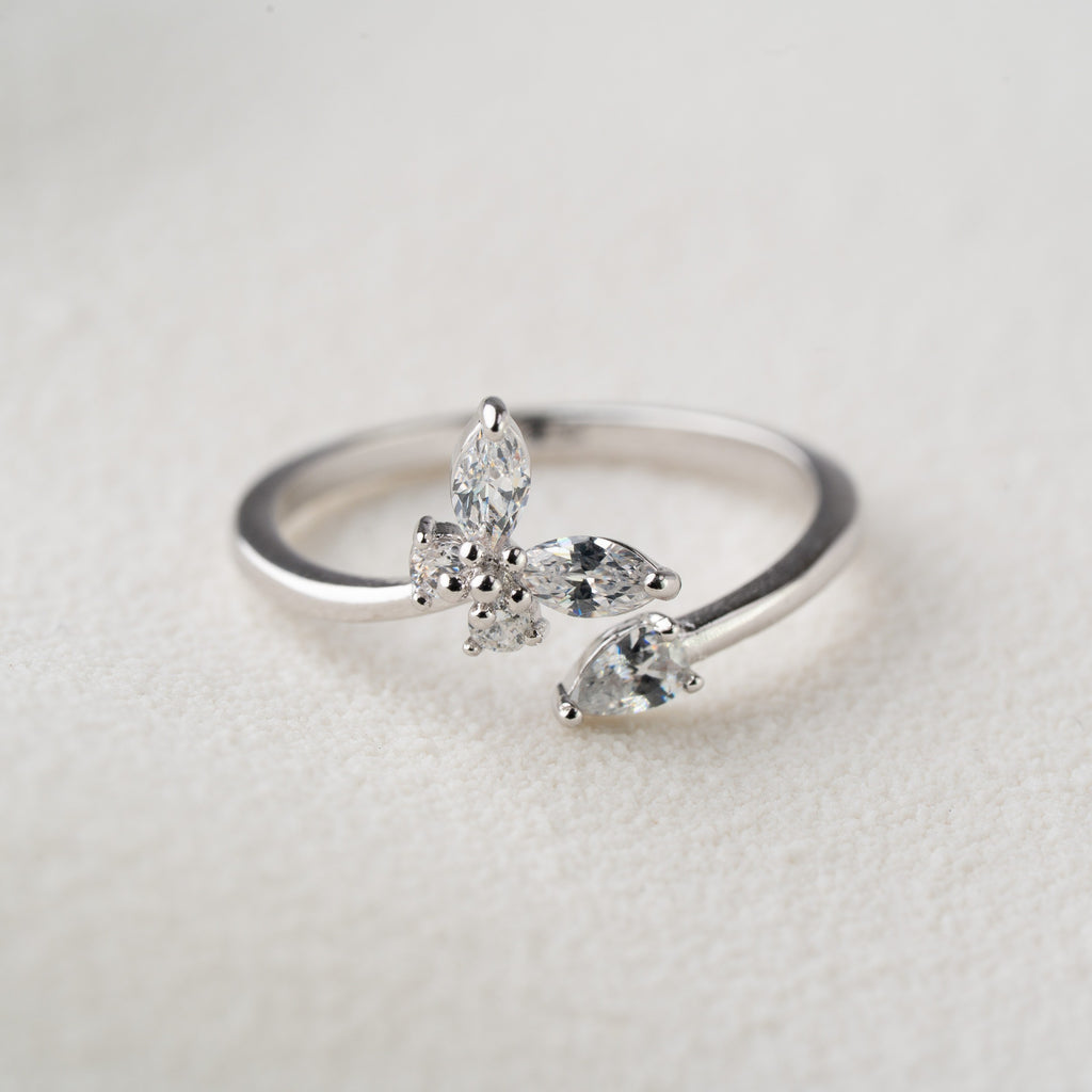 Minimal Floral Spark Ring with Crystal Petals