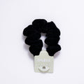 Black scrunchie on a white background
